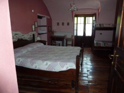 Eines der Zimmer im Posto Tappa in Ponte Maira